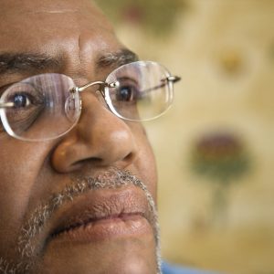 Portrait of senior black man in eyeglasses with serious expression.  Horizontal shot.